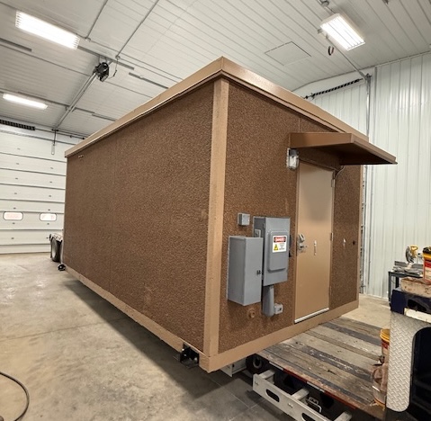 Newly reconditioned 11.5 x 20 Fibrebond concrete communication building for sale