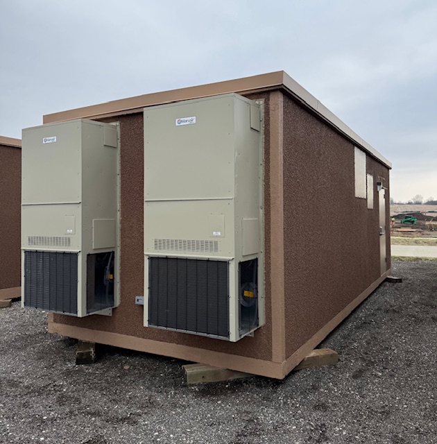 Refurbished 11.5x28 Fibrebond concrete communication building with new 4-ton air conditioning units